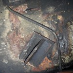 this is a previous repair someone carried out on the toe-panel/ subframe mount.  Not good...
